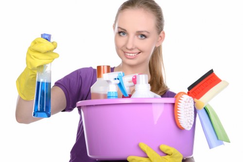 Cleaning staff member following safe working procedures